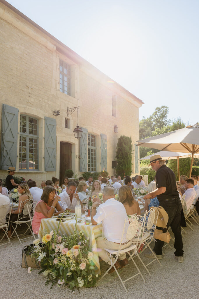 Outdoor wedding dinner in the South of France during early evening as part of the wedding day timeline