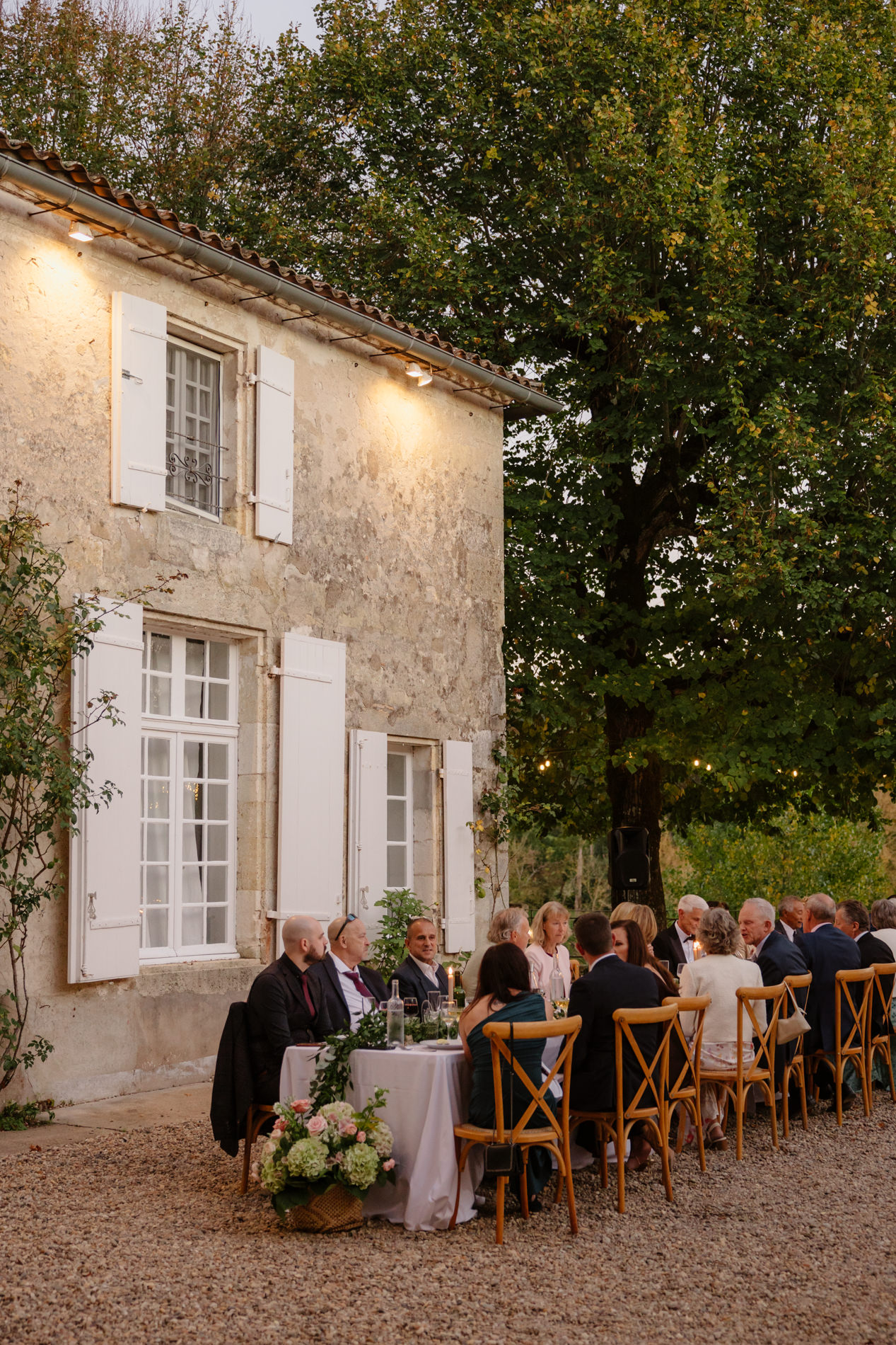 Outdoor wedding dinner in the South of France during early evening as part of the wedding day timeline