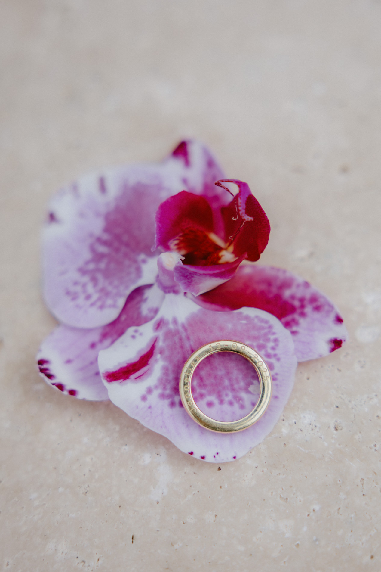 Wedding ring placed on an orchid at Domaine du Rodier