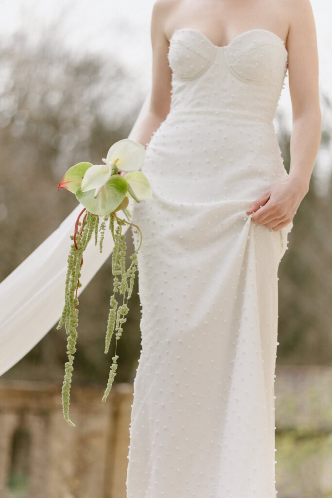 Wedding dress and bouquet styling details at Pont Bourguet near Toulouse