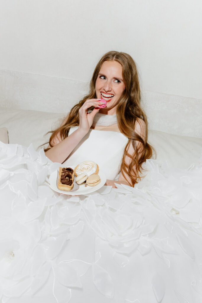 bride laughing with pastries at intimate wedding in Provence