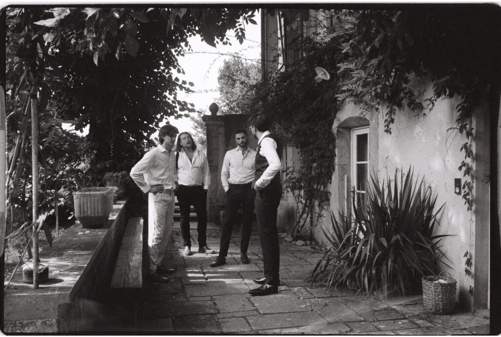 groom getting ready in Avignon on black and white 35mm film in Provence